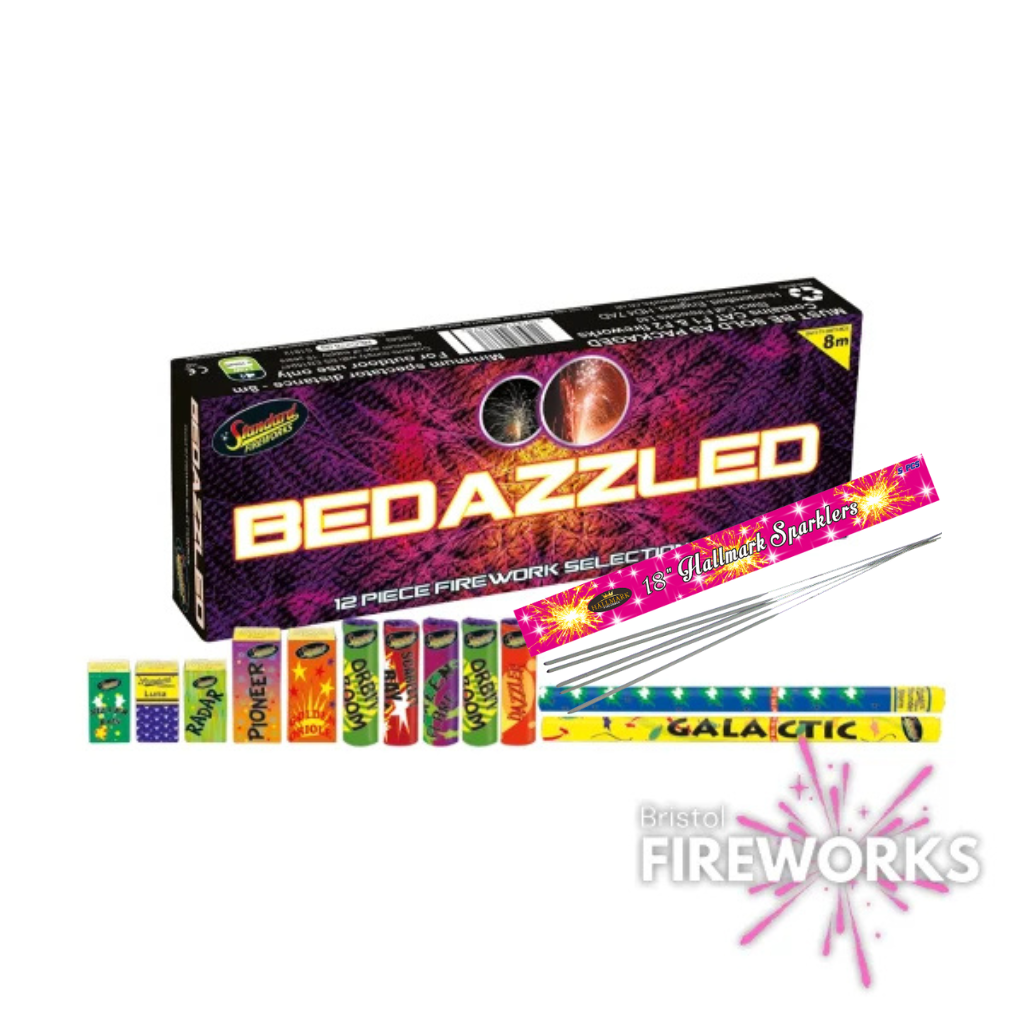 The "Bedazzled" 12 Piece Selection Box from Bristol Fireworks features colorful tubes, rockets, and extra sparklers in front, with the logo and a pink burst at the bottom right.
